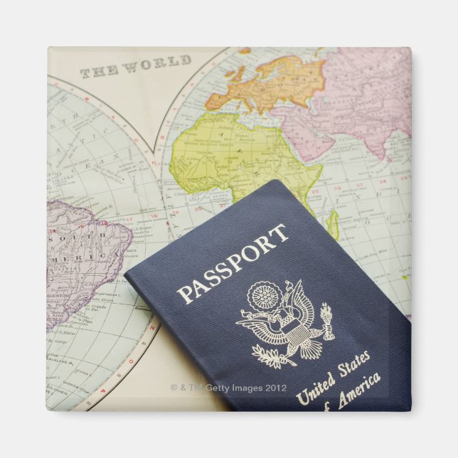 Close-up of passport lying on map magnet (Front)
