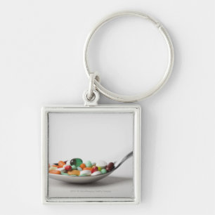 Close-up of pills in a spoon key ring