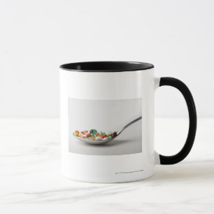 Close-up of pills in a spoon mug