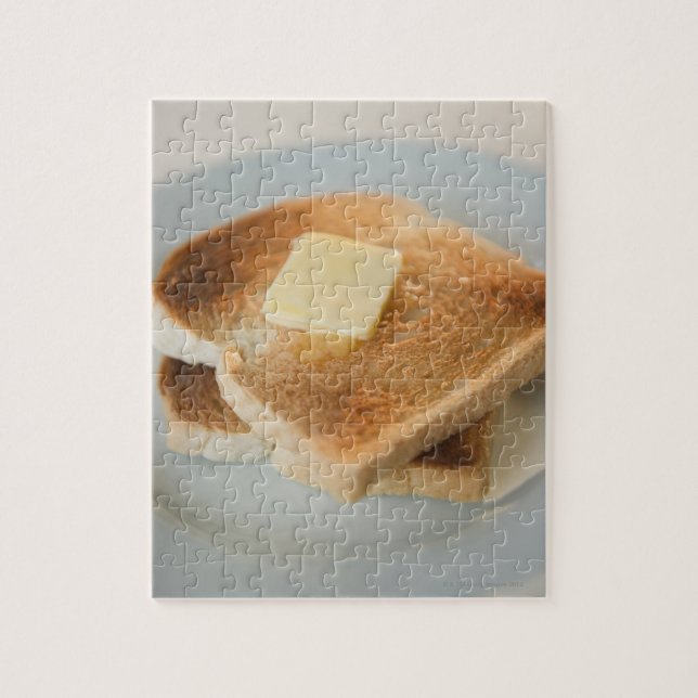 Close up of toasts with butter on plate jigsaw puzzle (Vertical)