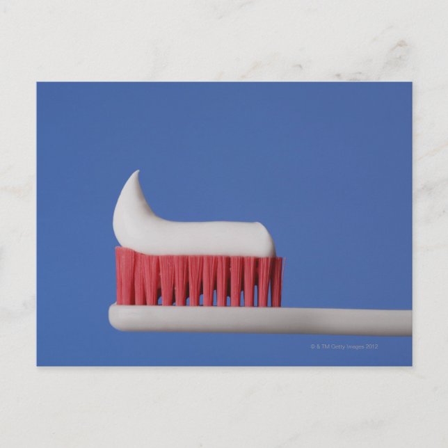 Close-up of toothpaste on a toothbrush postcard (Front)