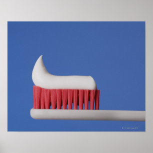Close-up of toothpaste on a toothbrush poster