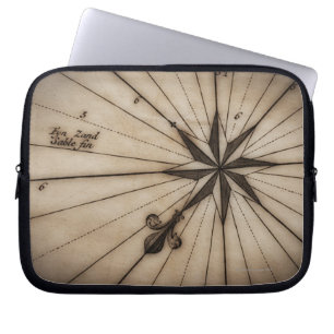 Close up of wind rose on antique map laptop sleeve
