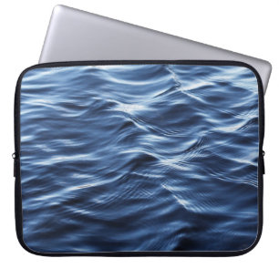 CLOSE UP PHOTO OF BODY OF WATER LAPTOP SLEEVE