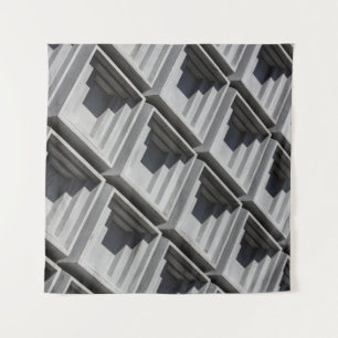 Close-up photo of grey building tapestry