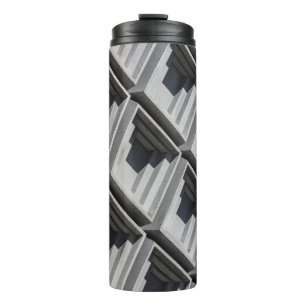 Close-up photo of grey building thermal tumbler