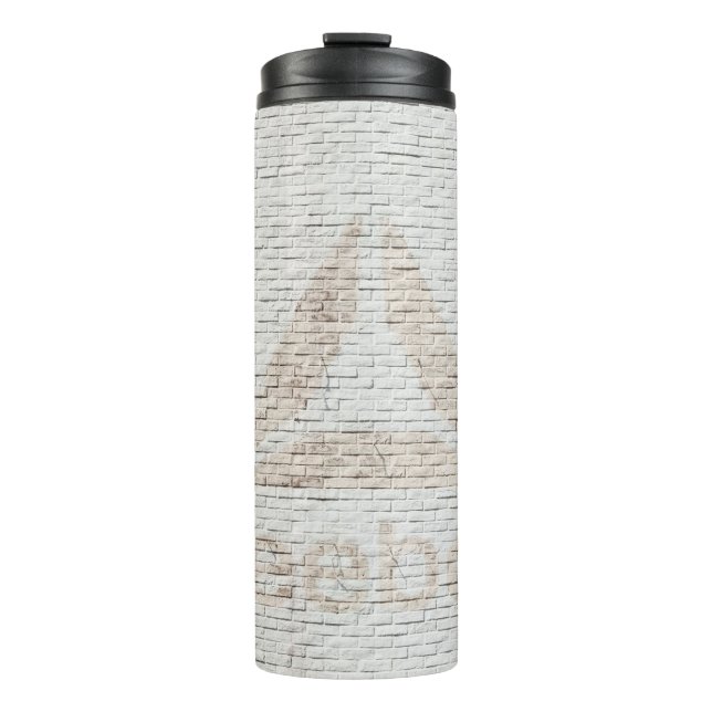 Close-up photo of Reebok logo on wall Thermal Tumbler (Front)