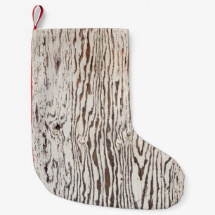 Close up photography of brown wooden surface small christmas stocking
