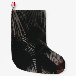 CLOSE-UP PHOTOGRAPHY OF GREEN LEAFED PALM SMALL CHRISTMAS STOCKING