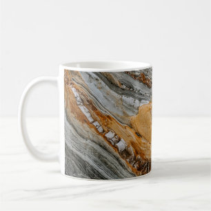 Close-up photography of grey and orange stones coffee mug