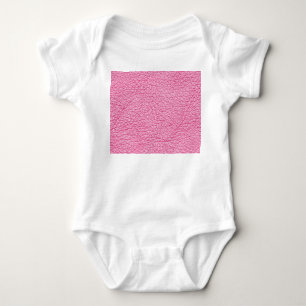 Close-up pink leather, textured background. baby bodysuit