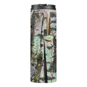 Close-up scene of birch log stumps, cool thermal tumbler
