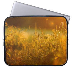 Close up silhouette of a grass field by sunsetabst laptop sleeve
