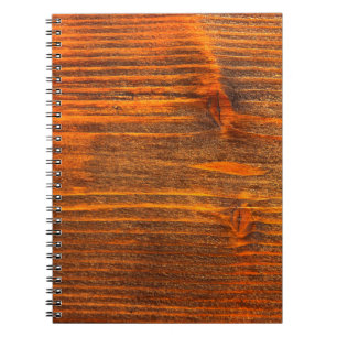 Close-up texture of old wooden floor, part of the notebook