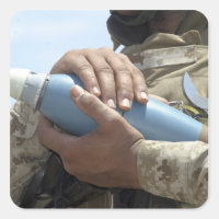 Close-up view of a soldier cradling a munition