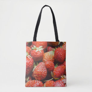 Close-up view on fresh summer strawberry with vint tote bag