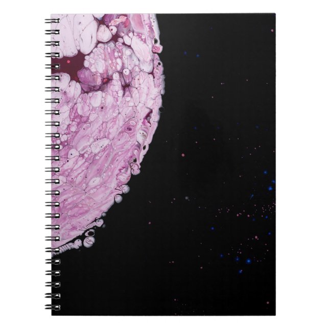 Close view of pink planet cartoon image notebook (Front)