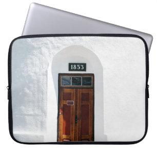 CLOSED 1852 WOODEN DOOR AT DAYTIME LAPTOP SLEEVE