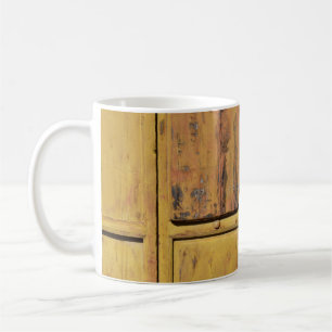 Closed brown wooden cabinet coffee mug