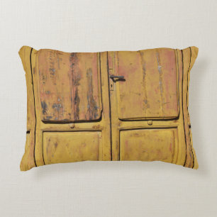 Closed brown wooden cabinet decorative cushion