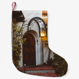 CLOSED BROWN WOODEN DOOR DURING DAYTIME SMALL CHRISTMAS STOCKING