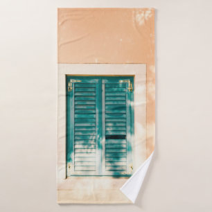 Closed green wooden door bath towel