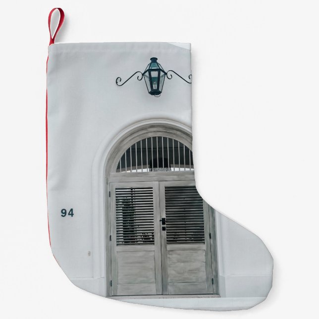 CLOSED GREY WOODEN DOOR BELOW BLACK LIGHT SCONCE SMALL CHRISTMAS STOCKING (Front)