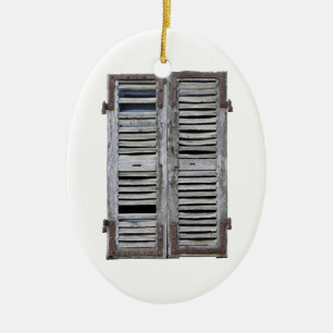Closed window with old wood shutters ceramic tree decoration