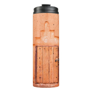 Closed wooden window in traditional moroccan house thermal tumbler