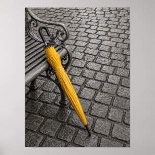Closed Yellow Umbrella Beside Park Bench Poster