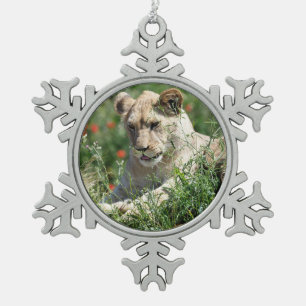 Closeup lion cub among the vegetation   snowflake pewter christmas ornament