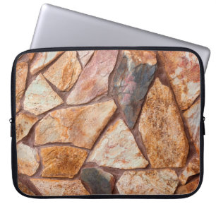 Closeup of a stone wall as a backgroundwallpaper,p laptop sleeve