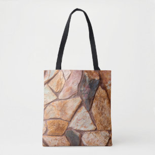 Closeup of a stone wall as a backgroundwallpaper,p tote bag