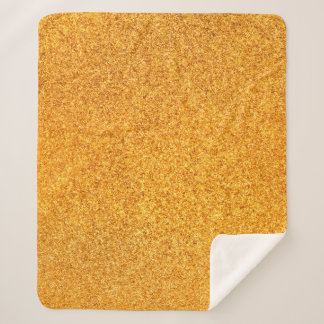 Closeup of golden matte metal texture. Shiny metal Sherpa Blanket