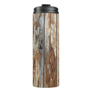 Closeup photo of brown wooden board thermal tumbler