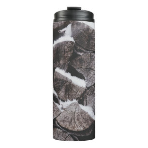 Closeup photo of firewood stack thermal tumbler