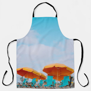 Closeup photo of lounger chairs and beach umbrella apron
