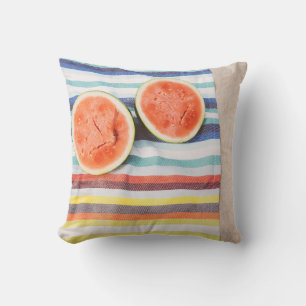 Closeup photo of slice watermelon fruits on cloth cushion