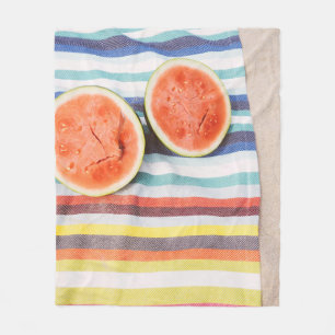 Closeup photo of slice watermelon fruits on cloth fleece blanket