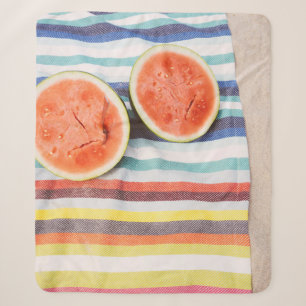 Closeup photo of slice watermelon fruits on cloth sherpa blanket