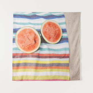 Closeup photo of slice watermelon fruits on cloth tapestry