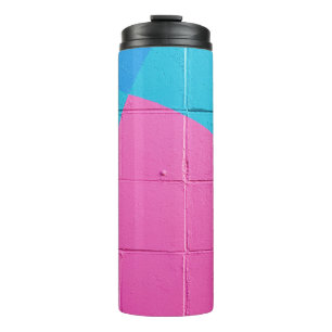 Closeup photo of teal and pink wall thermal tumbler