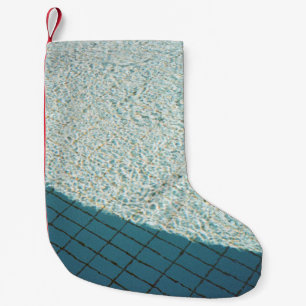 Closeup photo of white tile lot small christmas stocking