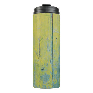 Closeup photo of yellow and teal wooden board thermal tumbler