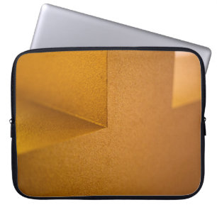 Closeup photo of yellow wall laptop sleeve