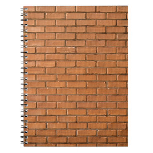 Closeup photography of brown brick wall notebook