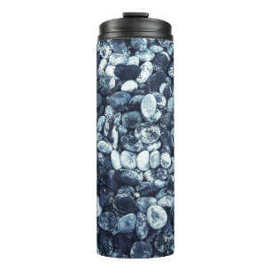 Closeup photography of stones thermal tumbler