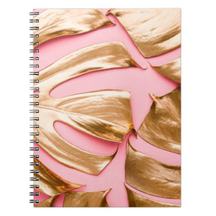 Closeup view of natural gold painted monstera trop notebook