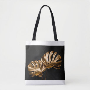 Closeup view of two luxurious golden painted tropi tote bag