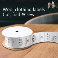 Clothing garment labels Care logo sheep wool white
